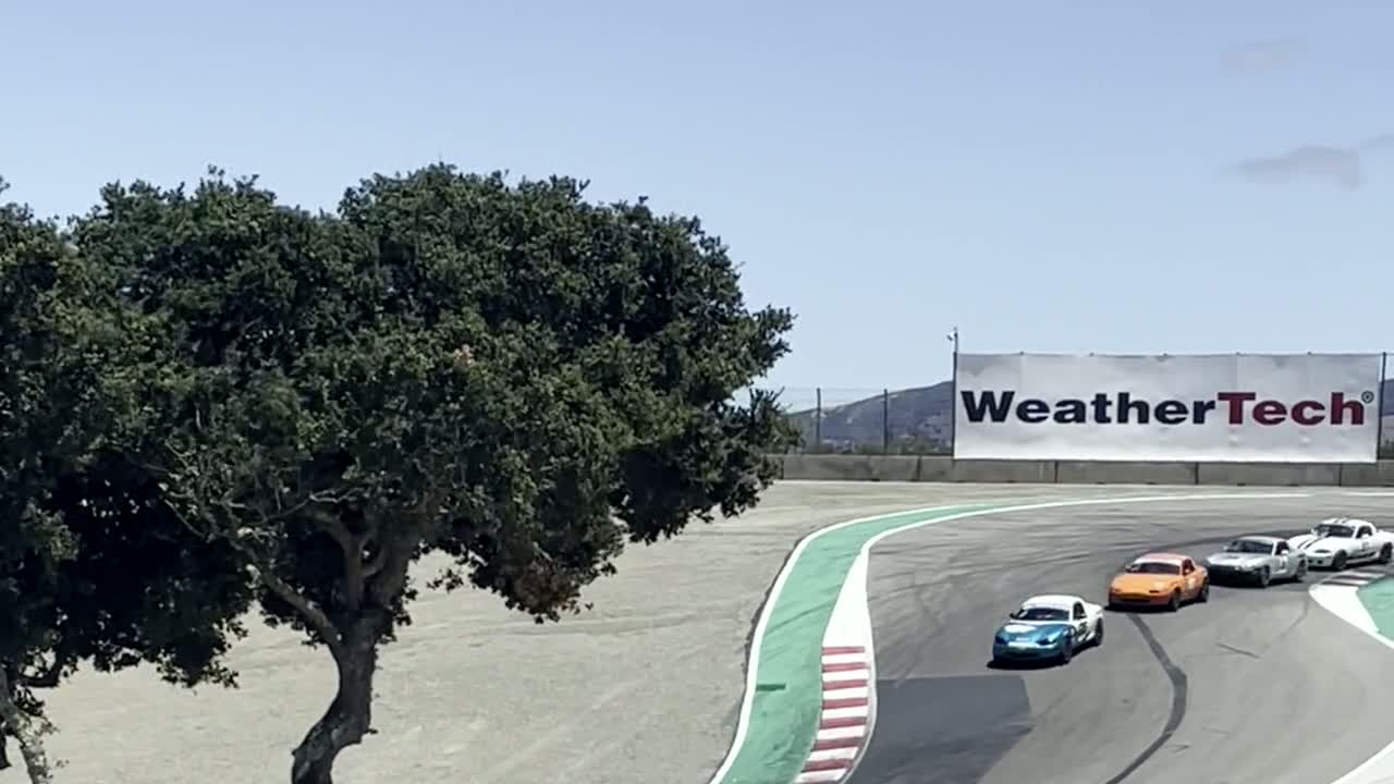 Race cars approaching a corner on track